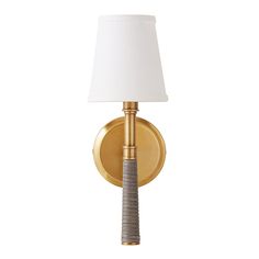 a wall light with a white shade on the side and a gold metal frame around it