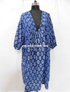 "This eye-catching Indigo Print dress is a winner for summer. This is ideal for breakfast in the hotel, lunch at the beach and pottering round the local market. Even better, you can feel good about wearing it as well as looking good. Like most of our products, this dress is handmade using the traditional Indian techniques of block printing and all our suppliers are ethically approved. It suits every occasion as while it is made from top quality cotton voile, which keeps you cool in the sun, It a Bohemian Cotton Beach Dress For Brunch, Printed Beachwear Dress For Brunch, Printed Beach Dress For Brunch, Bohemian Printed Beach Dress For Brunch, Indigo Cotton Kaftan For The Beach, Blue Cotton Kaftan With Batik Print, Indigo Batik Print Beach Dress, Casual Block Print Dress For Beach Cover-up, Blue Block Print Dress For Beach Cover-up