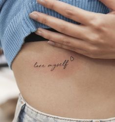 a woman's stomach with the words love my life written on it, in cursive font