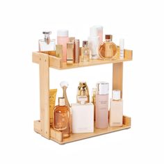 a wooden shelf filled with different types of perfumes