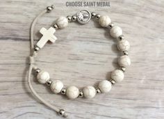 Saint Medal Rosary Bracelet Custom Handmade Christian Jewelry - Etsy Spiritual White Rosary Bracelet With Round Beads, White Spiritual Rosary Bracelet With 8mm Beads, Adjustable White Rosary Bracelet, Personalized Adjustable Spiritual Rosary Bracelet, Adjustable Personalized Spiritual Rosary Bracelet, Adjustable Miraculous Medal For Gift, White Spiritual Cross Jewelry And Charms, Nickel Free Cross Bracelet With Spiritual Style, Nickel-free Cross Bracelet For Spiritual Style