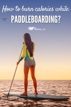 a woman paddle boarding in the ocean with text overlay reading how to turn calories while paddling?