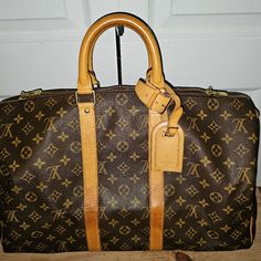 Louis Vuitton Keepall 45 Monogram Sp0958 Bag Monogram Canvas Size Large Measurement 17.8” X 10.7” X 7.9 Color Brown Zipper As Closure At Top Gold Hardware With Hangtag Clean Inside Preowned No Holes Wayer Marknis Present Due To Preowned Already Smoke Free Rectangular Monogram Canvas Bag With Luggage Sleeve, Monogram Canvas Rectangular Duffle Bag, Brown Monogram Canvas Bags For Business Trips, Rectangular Monogram Canvas Duffle Bag For Everyday, Rectangular Monogram Canvas Duffle Bag, Designer Monogram Canvas Luggage For Everyday Use, Luxury Monogram Canvas Duffle Bag, Classic Monogram Canvas Travel Bag For Business, Designer Monogram Canvas Travel Bag