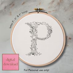 a cross stitch pattern with the letter p in it's center and an embroidered monogram