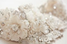 the bridal hair comb is adorned with crystal and pearls