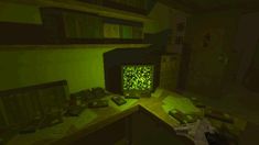 a computer screen sitting on top of a wooden desk in a room filled with books