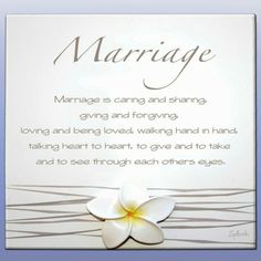 a card with a white flower and the words marriage written in brown ink on it