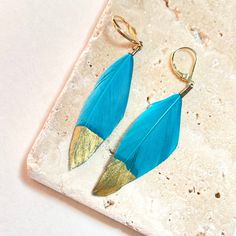 These electric blue earrings are the perfect accessory for the summer festival season. Neon pink feathers dipped in luxurious gold. Style with other gold earrings for the ultimate boho look. Your feather earrings will arrive tastefully packaged in a velvet pouch making them an ideal gift. Dimensions Approx 5cm in length. Made from Feathers & gold plated brass. Dipped Feathers, Pouch Making, Blue Feathers, Gold Jewelry Earrings, Blue Feather, Pink Feathers, Velvet Pouch, Gold Dipped, Feather Earrings