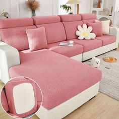 a living room with pink and white furniture