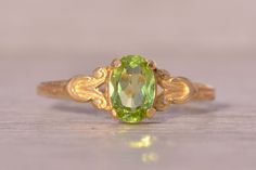 The Hove: Peridot Ring in Yellow Gold with Patterned Shank. This delicate ring centers on an oval brilliant-cut natural peridot with a patterned shank. The ring is crafted in 14 karat yellow gold and is currently a finger size 4.25 yet can be adjusted to any finger size for an additional charge on request. Love this piece, but don't have the money to spend right now?  We offer FREE layaway on every item in our shop.  With just 20% down, take one full year (interest-free) to pay off your new jewe Peridot Ring, Jewelry Lookbook, Wedding Dreams, Delicate Rings, The Money, Rings Statement, Statement Rings, Jewelry Rings, Etsy Accessories