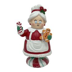 a glass ornament with an image of a woman holding a candy cane and a gingerbread