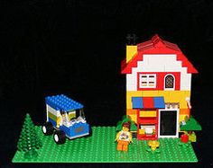 a lego house is shown with a toy truck