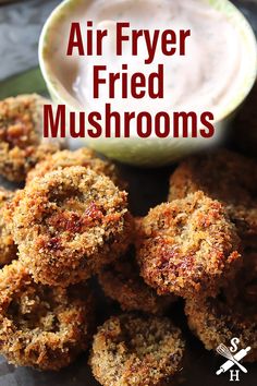 air fryer fried mushrooms on a plate with ranch dip in the background and text overlay