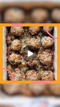 a box filled with meatballs covered in cheese and seasoning sitting on top of a table