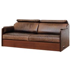 a brown leather couch sitting on top of a wooden frame