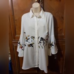 Ladies Womens Embroidered Blouse Top With Big Bell Sleeves. Ivory, Brand New With Tags, Perfect Unworn Condition, Size Medium. Tunic Style 20 Inches Across Armpit To Armpit. 30 Inches Long From High Shoulder. White Long Sleeve Embroidered Top With Floral Print, White Long Sleeve Top With Floral Embroidery, White Collared Blouse With Floral Print, Chic Collared Blouse With Floral Embroidery, Collared Blouse With Floral Embroidery For Work, Chic White Embroidered Blouse, White Floral Embroidered Shirt For Work, Chic White Tops With Embroidered Sleeves, Elegant White Shirt With Floral Print