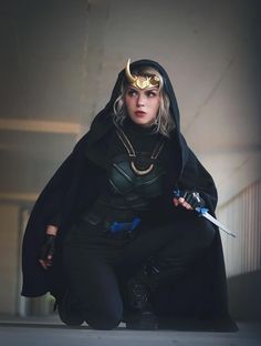 a woman dressed as loki in a costume