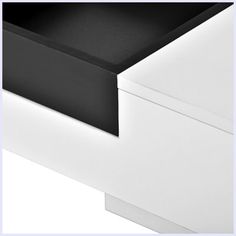 a white and black dresser with drawers