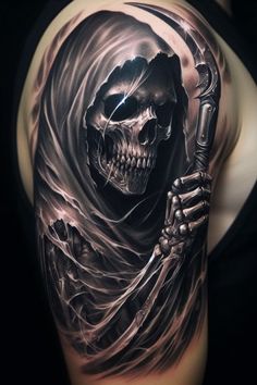 a man's arm with a skull and skeleton holding a hammer on it, while wearing