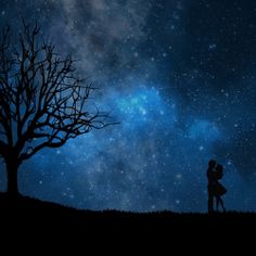 two people standing under a tree with the stars in the sky