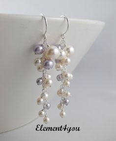 ~~Lavender, Cream, Silver~~  Earrings Long pearl clusters earrings by Element4you 30.00 White Pearl Chandelier Earrings For Anniversary, Pearl White Cluster Earrings With Pearl Drop For Wedding, Silver Pearl Cluster Earrings For Anniversary, Elegant White Earrings For Bridesmaids, White Dangle Earrings For Bridesmaids, White Dangle Bridal Earrings For Bridesmaid, Pearl White Wedding Cluster Earrings With Pearl Drop, White Pearl Drop Cluster Earrings For Anniversary, White Pearl Earrings For Bridesmaids