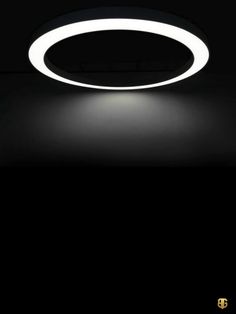 a circular light that is lit up in the dark