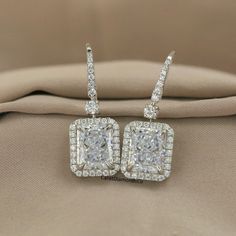 Classic Dangle Drop Wedding Earrings, 10X8 MM Radiant Cut Ice Crushed Simulated Diamond Earrings, Halo & Pave Set Earrings In 10K White Gold ✺ Description ✺ Detail about stones Moissanite & Simulated Stone: ----------------------------- Stone Shape: Radiant Cut  Stone Size: 10X8 MM Weight: 7 TCW Color: Colorless Cut: Excellent Clarity: VVS ✎ This is all our photography. This listing image is only reference image. If you give me order then I will make this jewelry looks like listing's image ✺ Place your custom order here ➣ The handmade Moissanite made with Festinating and Brilliance. Stone is produced with Excellent Cuts, Grades and Superior Quality. ➣ Metal Option: Silver/10KT/14KT/18KT ➣ Metal Tones: Yellow Gold, White Gold, Rose Gold ✺ Stone type options: ➣ Natural Diamond, Lab-grown dia Types Of Diamond Cuts, Wedding Earrings Drop, Set Earrings, Radiant Cut, Precious Jewelry, Wedding Earrings, Designer Earrings