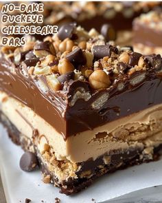 there are no - bake cheesecake bars with nuts on top and chocolate in the middle