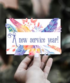 someone holding up a card that says a new service year