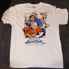 an avatar t - shirt is laying on the floor