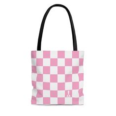 "This tote bag is quite practical and available in three sizes.  Its design provides a sense of style, whether hanging on the beach or out on the town.  The design features a checkered pattern, simulating a Chess board, with the iconic \"Buenos New Chess\" logo centered on a dark square on the lower right of each side. .: Pink and White .: 100% Polyester .: Boxed corners .: Black cotton handles .: Black lining .: Printed on both sides Small:       Width - 3.14 in.  Length - 13 in.  Height - 13 i Chess Logo, All Pink, Checkered Pattern, Chess Board, Chess, Pink And White, Black Cotton, Tote Bag, Purses And Bags