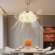 a dining room table with chairs and a chandelier hanging from it's ceiling