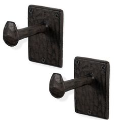 pair of black iron door handles with square knobs on each side, isolated against a white background