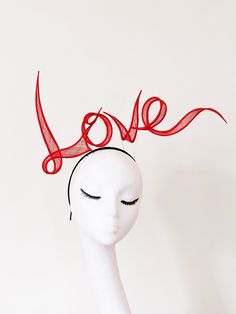 "No more availability in June 2023. Earliest dispatch 4th July 2023. thanks  No more availability in June 2023. Earliest dispatch 4th July 2023. thanks No more made to order available for Royal Ascot. Love is in the air!  Wear Your Heart On Your Head. Recently the Love headband is featured in editorial of UNBLOCKMAGAZINE \"LOVE ISSUE\". Hand rolled sinamay letters slogan in words or names, flowing on top of the headband, delicately connected with wires, with intricate craft skills and painstaking patience. The picture shows as LOVE for one words.  Customised names or words in special colours are Made to order. Price according the number of characters and size. Bigger or more words are more expensive.  Please contact info@yuanli.london for price and details. all hand made inside out  Materi Red Christmas Costume Hat For Party, Red Christmas Party Costume Hat, Red Christmas Party Headpiece, Red Fitted Hat For Gift, Red Fitted Hat As Gift, Red Fitted Hats As Gifts, Holiday Evening Fascinator, Holiday Wedding Fascinator With Adjustable Fit, Red Mini Hat For Christmas Party