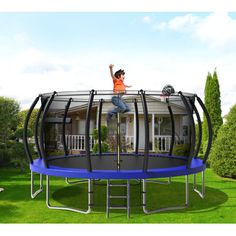 a man jumping on top of a trampoline