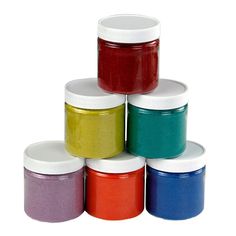 six different colors of paint in small jars