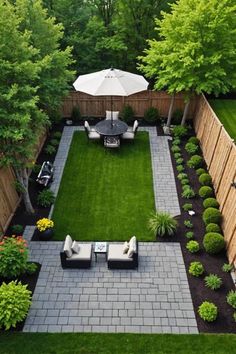 a small backyard with an umbrella and seating area