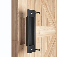 a wooden door with a black handle on it