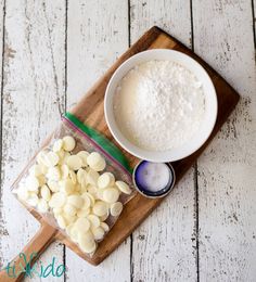 the ingredients to make this recipe include almonds, milk, and sugar on a cutting board