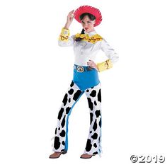 a woman in a cowgirl costume is posing for the camera with her hands on her hips