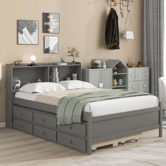 a bedroom with a bed, dresser and shelves