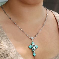 "This Turquoise cross pendant necklace features opal glass stones. The cross is magnesite, a turquoise colored mineral. Find hope and renewal in familiar and evocative symbols of religion and love. Since prehistoric times the cross has symbolized life, fertility, health and immortality. Like many symbols, the cross represents a broad spectrum of ideas. It is viewed as a coordinate where north, south, east and west come together. It also joins the four elements of earth, wind, fire and water. It Turquoise Cross Pendant Necklace As Gift, Confirmation Necklace, Elephant Charm Necklace, Turquoise Cross Pendant, Lucky Charm Necklace, Necklace Opal, Turquoise Jewelry Native American, Necklace Cross, Turquoise Cross