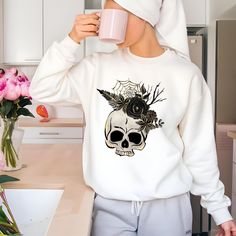 Comfort Colors® Floral Skull Sweatshirt, Retro Skeleton Shirt, Halloween Skull Sweatshirt, Spooky Shirt, Halloween Y2k Shirt, Fall Sweater 👕 *Our sweatshirts are made from Comfort Colors® branded fabric, ensuring superior softness and quality. 🌿 + MATERIAL: 100% Ring-spun cotton Light fabric (6.4 oz/yd² or 217 g/m²) Imported 🌍 Sewn-in twill label 🧵 Machine washable 🧼 Rolled forward shoulder for a relaxed fit 👕 Printed with OEKO-TEX-certified low-impact dyes 🌱 Rolled-forward 🌎 + SUSTAINAB Winter Skull Print Relaxed Fit Tops, Relaxed Fit Skull Print Tops For Winter, Halloween Cotton Sweatshirt With Skull Print, Fall Skull Print Crew Neck Top, Long Sleeve Skull Print T-shirt For Fall, Fall Skull Print Long Sleeve T-shirt, Relaxed Fit Skull Print Top For Halloween, Halloween Long Sleeve T-shirt With Skull Print, Spooky Skull Print Fall Top