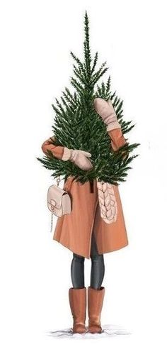 a person holding a christmas tree in their hands