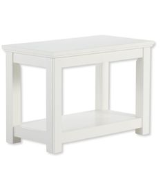 a small white table with one shelf on top