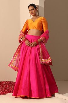 Hot pink solid lehenga crafted in tafetta silk with statement tassels. Paired with a blouse and gota lace bordered dupatta.
Components: 3
Pattern: Embroidered
Type Of Work: Gota lace
Neckline: V Neck
Sleeve Type: Elbow
Fabric: Lehenga and Blouse: Tafetta Silk, Dupatta: Soft Net
Color: Pink
Other Details: 
Length:
Lehenga: 40 inches
Dupatta: 2.5 mtrs
Dupatta width: 44 inches
Occasion: Mehendi and Haldi - Aza Fashions Party Lehenga With Latkans In Traditional Drape, Navratri Sharara With Latkans, Navratri Party Sets With Latkans, Party Sets With Latkans For Navratri, Bollywood Style Lehenga With Latkans, Bollywood Style Lehenga With Latkans For Navratri, Festival Choli With Latkans, Eid Sharara With Latkans, Eid Lehenga With Traditional Drape And Latkans