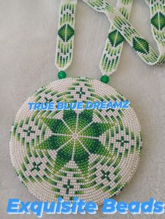 the beaded bag is green and white with a shamrock on it's side