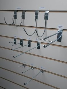 there are several metal hooks on the wall