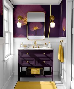 a bathroom with purple and gold decor on the walls, two sinks and a mirror