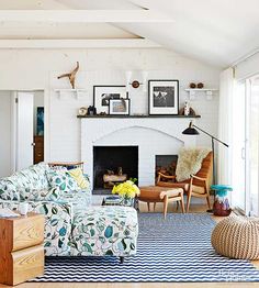 a living room filled with furniture and a fire place